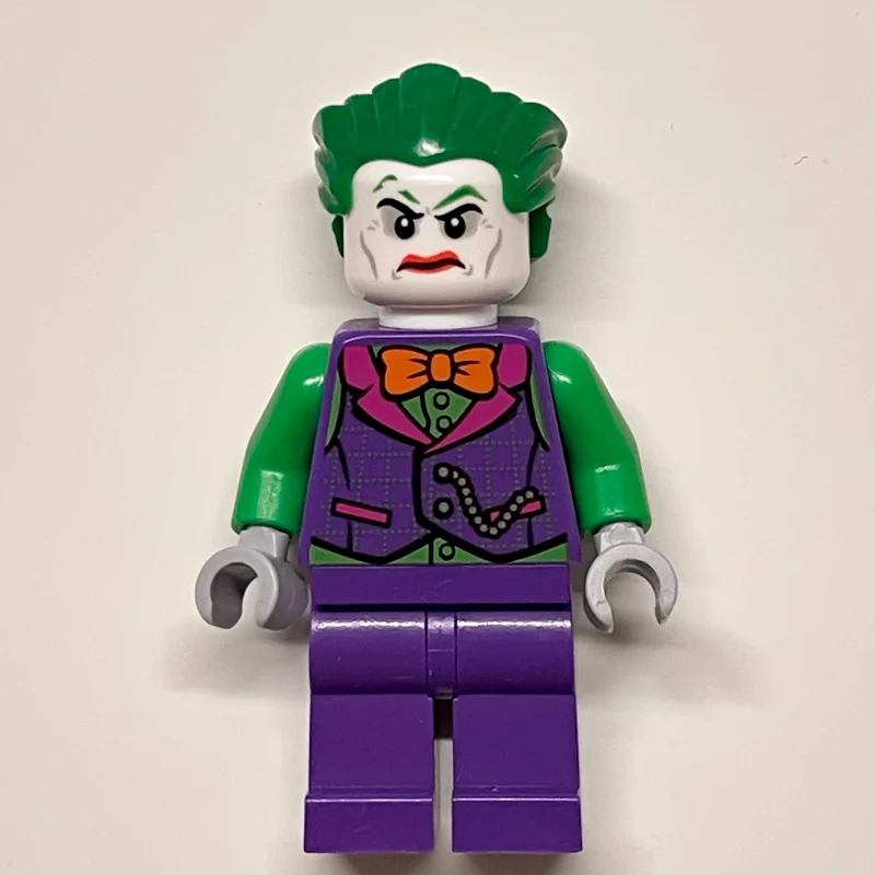 The Joker with Dark Purple Vest Over Green Shirt and Orange Bow Tie